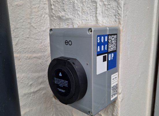 Picture of EO Mini Pro 2 EV charger on the garage wall